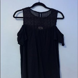 Black, “cold shoulder” top, with lace-like detail.